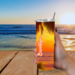 Woman holding beach tumbler outdoors with beautiful coastal view